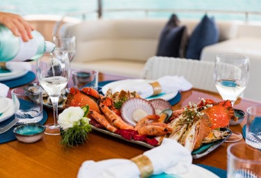 Culinary Delights Aboard: Your Guide To Fine Dining on Your Next Luxury Yacht Charter