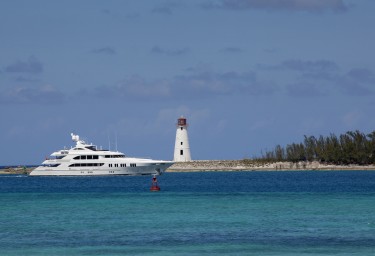 Luxury Charter Yacht Passing the Lighthouse