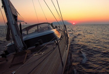 FARANDWIDE Sailing at Sunset